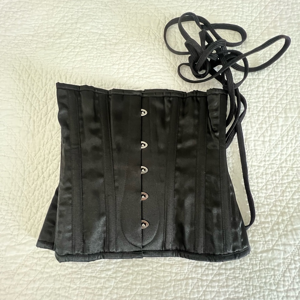 Black Waist Training Corset with Hook-and-Eye Closures.